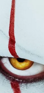 Creepy eye with red streak horror wallpaper.