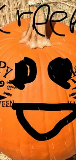 Creepy smiling Halloween pumpkin with 'Happy Halloween' text.