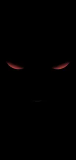 Dark wallpaper with glowing red eyes on black background.