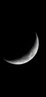 Crescent moon against a black night sky wallpaper.