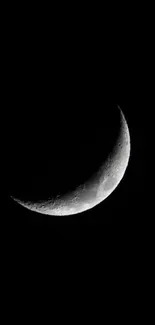 Crescent moon against a stark black background, perfect for phone wallpaper.