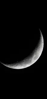 Crescent moon in dark night sky wallpaper.