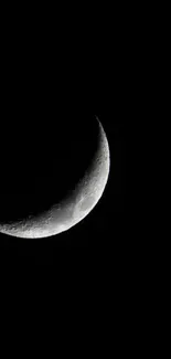 Crescent moon in a dark night sky wallpaper.