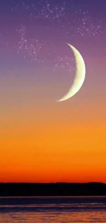 Crescent moon over vibrant orange sunset on ocean horizon.