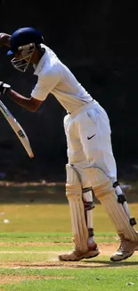 Cricket player in action on the field, wearing white uniform.