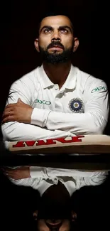 Reflective portrait of a cricket player in white jersey and black background.