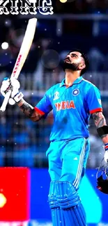 Cricketer in blue outfit celebrating victory on field.