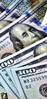 Stack of crisp hundred dollar bills in close-up view.