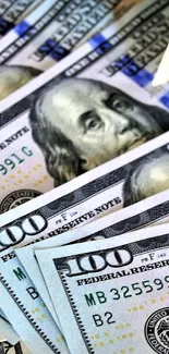 Mobile wallpaper of crisp hundred dollar bills showcasing currency design.