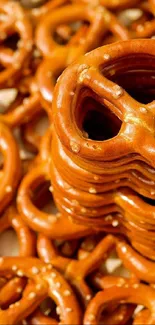 Brown pretzels stacked closely in high-quality mobile wallpaper.