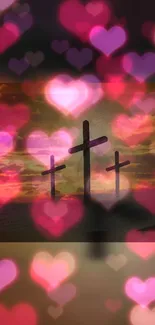 Three crosses with heart bokeh and sunset sky.