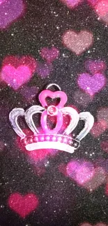 Sparkling crown with pink bow on black glitter background.