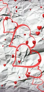 Crumpled paper with red heart patterns overlaid.