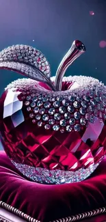 Luxurious crystal apple decorated with gems on a velvet cushion.