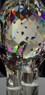 Crystal art with hand and light reflections.