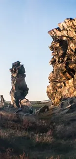 Crystal ball reflecting serene landscape with rock formations.