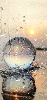 Crystal ball reflecting sunset with water droplets.