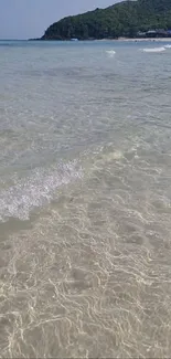 Clear beach waves with serene ocean view.