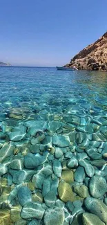 Crystal clear ocean with turquoise water and rocky shore view.