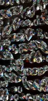 Close-up of shiny crystal gemstones creating a reflective pattern on wallpaper.