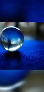 A crystal orb on a vibrant blue textured surface.