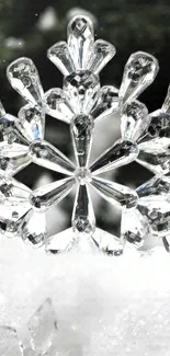 Elegant crystal snowflake against a snowy background.