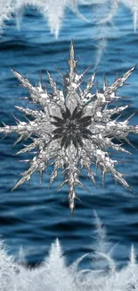 Intricate crystal snowflake over blue ocean waves wallpaper.