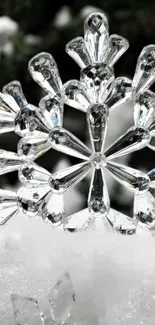 Close-up of a crystal snowflake on snow.