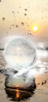 Crystal ball on water reflecting sunset splash.