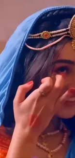 Woman in traditional attire with elegant jewelry.