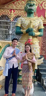 Cultural temple scene with traditional attire and vibrant architecture.