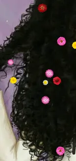 Curly black hair with colorful flowers on wallpaper.