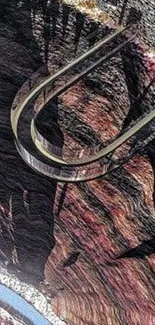 Curved highway over a detailed rocky canyon landscape.