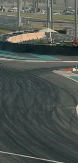 Curved race track with visible skid marks on asphalt.