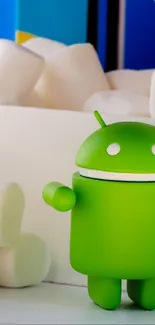 Cute Android figurine with marshmallows background.