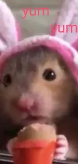 Guinea pigs wearing bunny hats, holding a carrot in a cute mobile wallpaper.