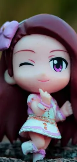 Cute anime figure with brown hair and vibrant colors.