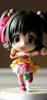 Adorable anime figurine with colorful, cheerful design on mobile wallpaper.