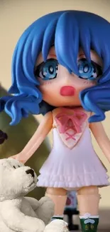 Anime figurine with blue hair and teddy bear.