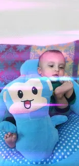 Adorable baby in a blue cushion with plush monkey toy, colorful background.