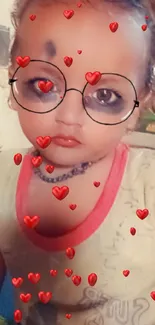 Baby with glasses filter on mobile wallpaper looking cute.