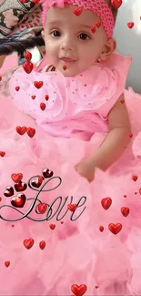 Adorable baby in pink dress with red hearts