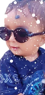 Adorable baby wearing sunglasses with snow effects, perfect for wallpapers.