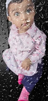 Cute baby in pink outfit with raindrop effect on a black background.