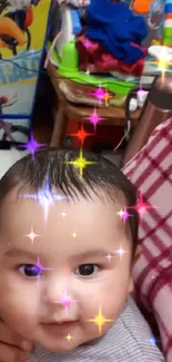 Smiling baby with colorful toys in the background.