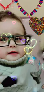 Cute baby with glasses and colorful heart-themed decoration.