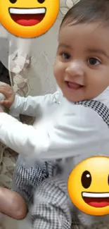 Cute baby in checkered outfit with smiling emojis.