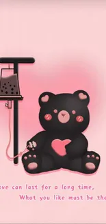 Cute black bear with pink heart on pink background wallpaper.