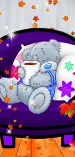 Cute teddy bear with a mug on a purple chair, surrounded by colorful autumn leaves.