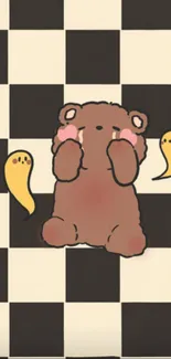 Cute bear on checkered wallpaper with yellow ghosts.